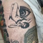 fine line, soft black and grey pin up with realistic eye tattoo in romford, essex at cult classic tattoo