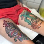 two large traditional thigh tattoos, dagger and gorilla and skull and octopus, both bright and bold tattooed in romford essex at cult classic tattoo