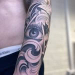 realistic black and grey eye tattoo, full sleeve tattooed in romford at cult classic tattoo
