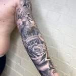 realistic rose and crown tattoo, black and grey fine line sleeve tattooed in romford, essex at cult classic tattoo