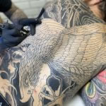 Aaron Hewitt working on a Japanese Bodysuit - Visible are a Japanese back piece and Japanese sleeve - tattooed at Cult Classic Tattoo in Romford, just outside of London